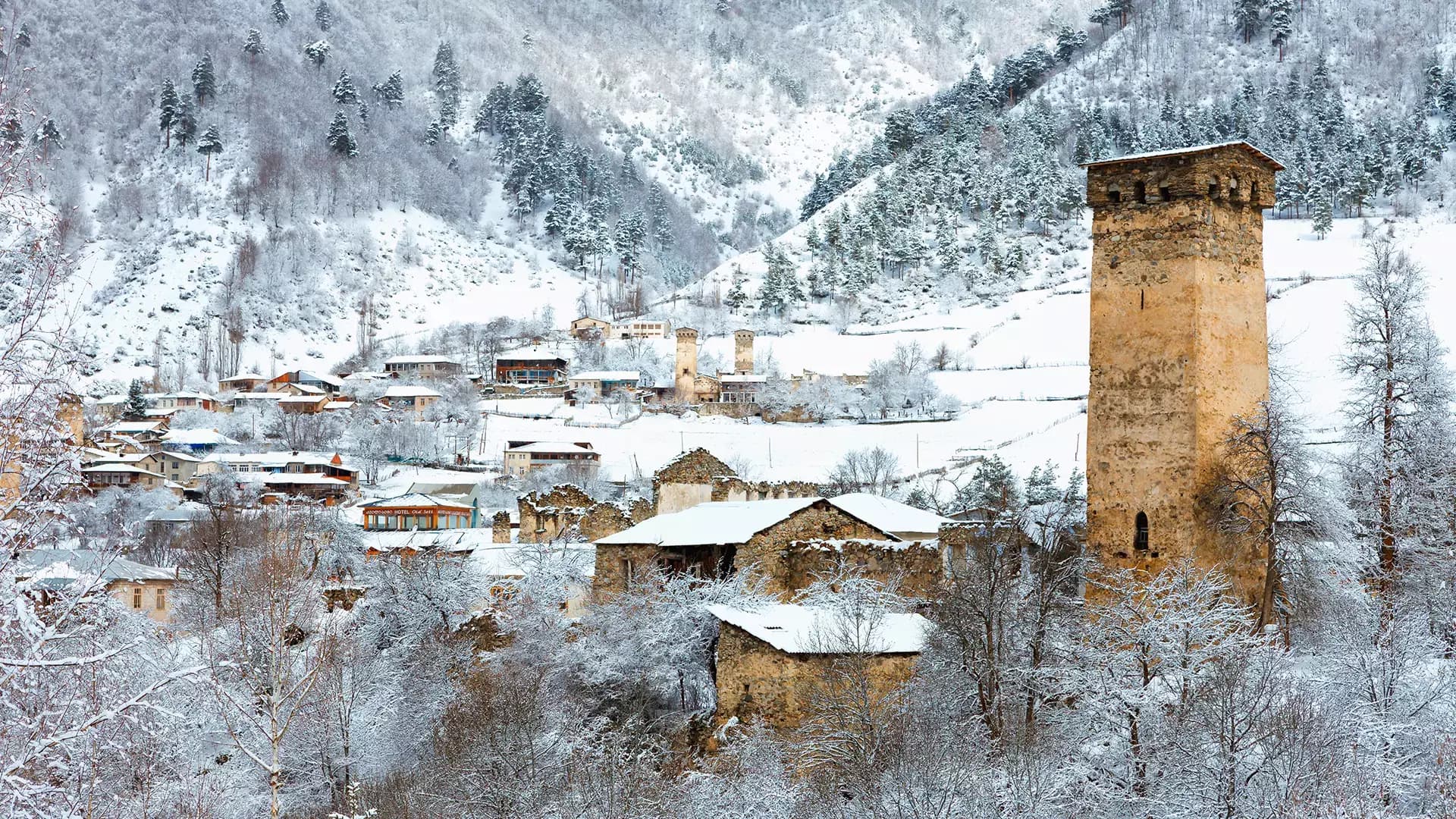 Skiers kicking snow under winter sun